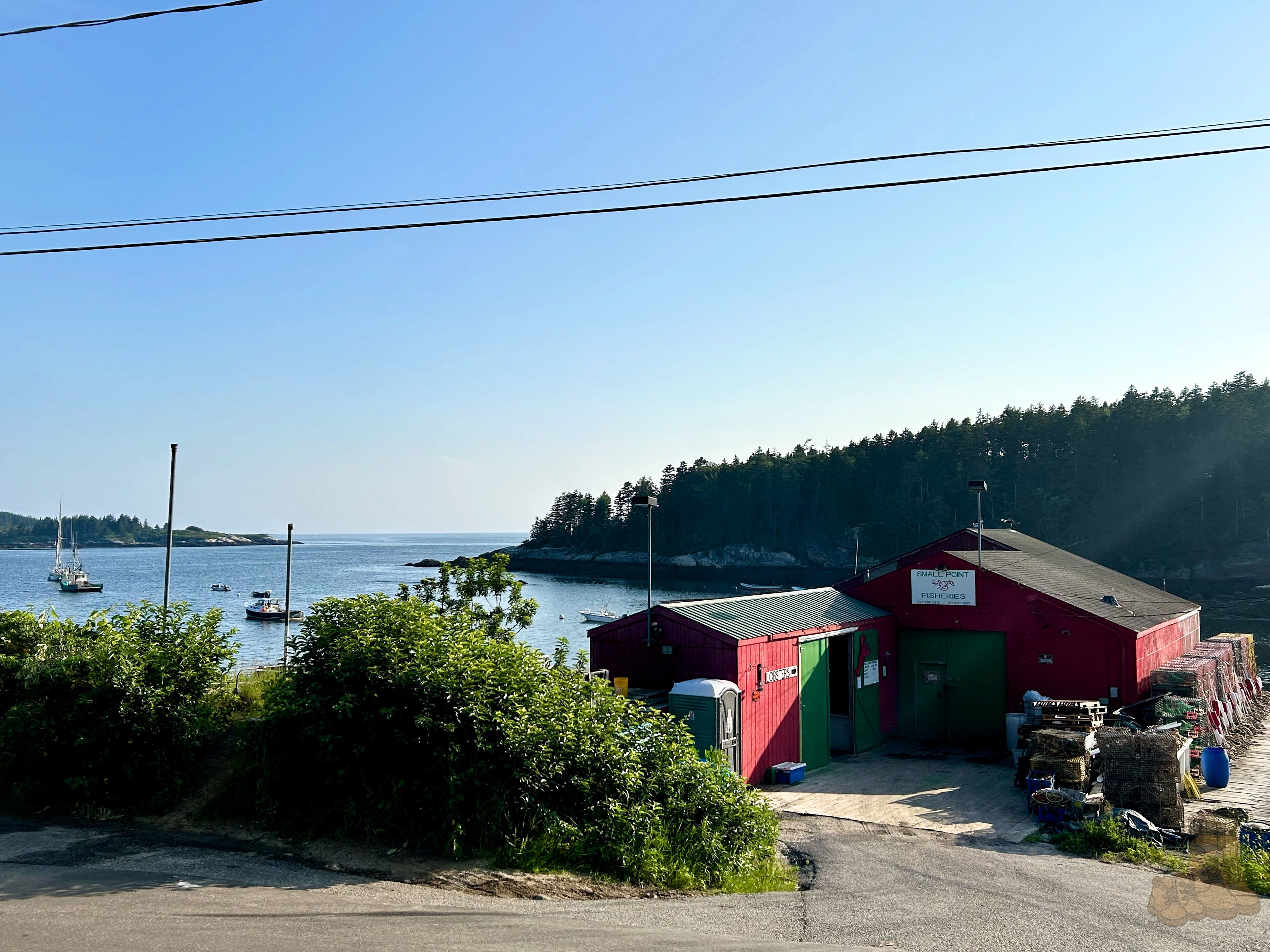 A view of a lobster fishing company in front of the ocean in Phippsburg, Maine